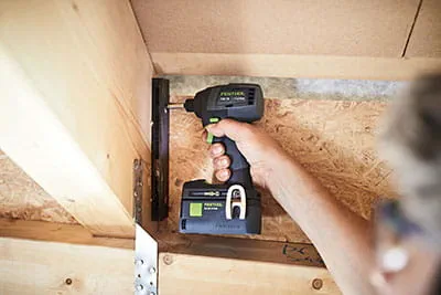 The Festool TID 18 cordless impact screwdriver in operation on the construction site