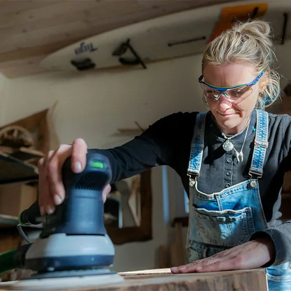 The wooden beams are worked using the Festool one-handed planer